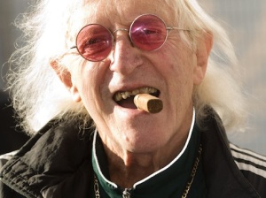 Sir Jimmy Savile attends the ceremony to name Cunard's new cruise-liner Queen Elizabeth II in Southampton Docks in Southampton, England.
